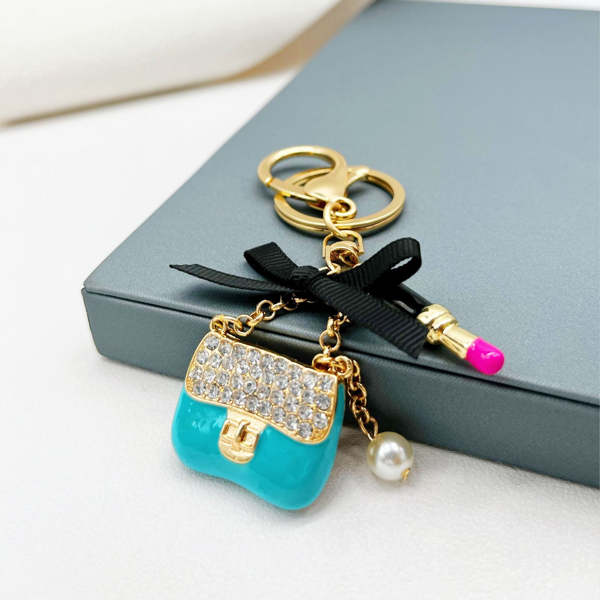 Wholesale Rhinestone Lipstick Bow Small Shoulder Bag Alloy Keychain